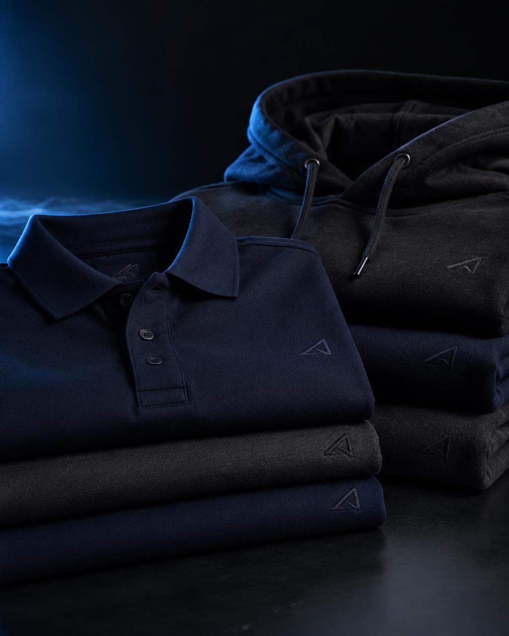 Stacked corporate polos and hoodies in navy and charcoal